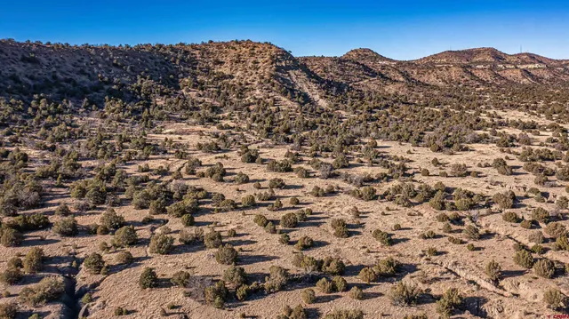 a view of a large body of water with a building in the background