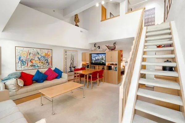 a bed room with furniture and a window