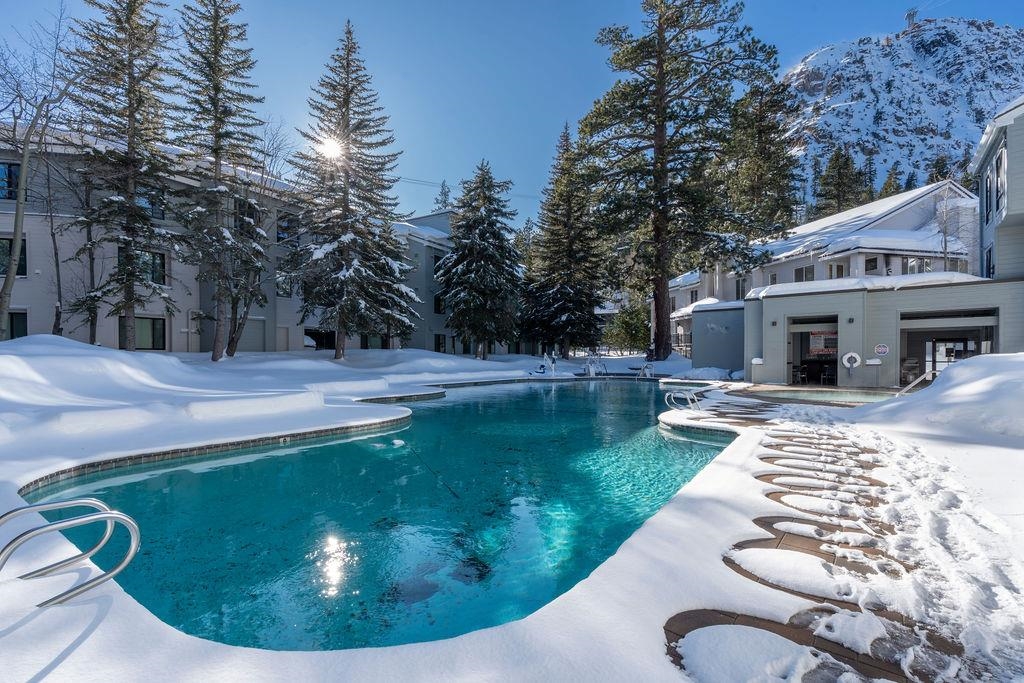 201 Shirley Cyn Road, Unit 309 Olympic Valley, CA 96146 - Photo 13 of 28 a view of a swimming pool with a patio