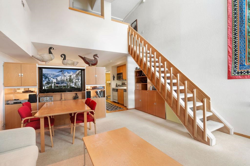 201 Shirley Cyn Road, Unit 309 Olympic Valley, CA 96146 - Photo 2 of 28 a living room with furniture and air hockey table