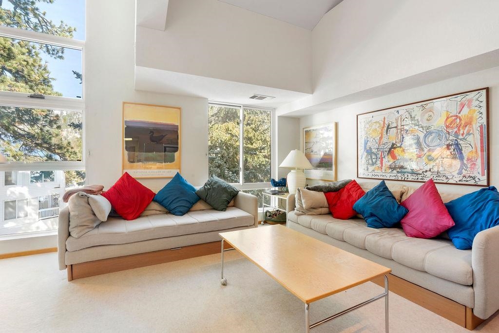 201 Shirley Cyn Road, Unit 309 Olympic Valley, CA 96146 - Photo 5 of 28 a living room with furniture and a large window