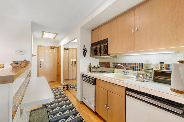 a bedroom with a bed and painting on the wall