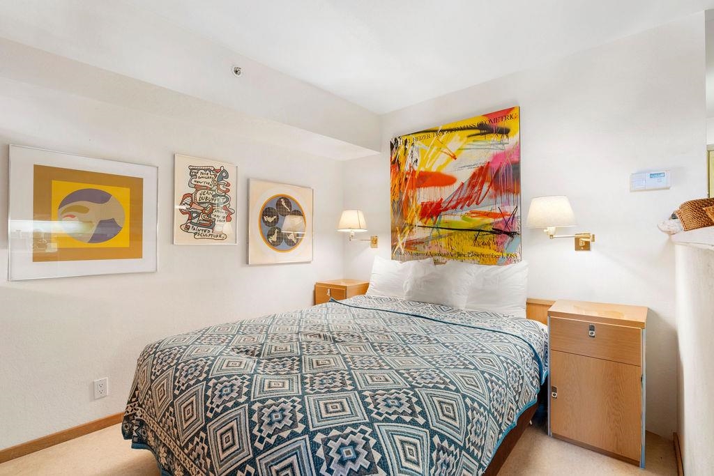 201 Shirley Cyn Road, Unit 309 Olympic Valley, CA 96146 - Photo 7 of 28 a bedroom with a bed and painting on the wall