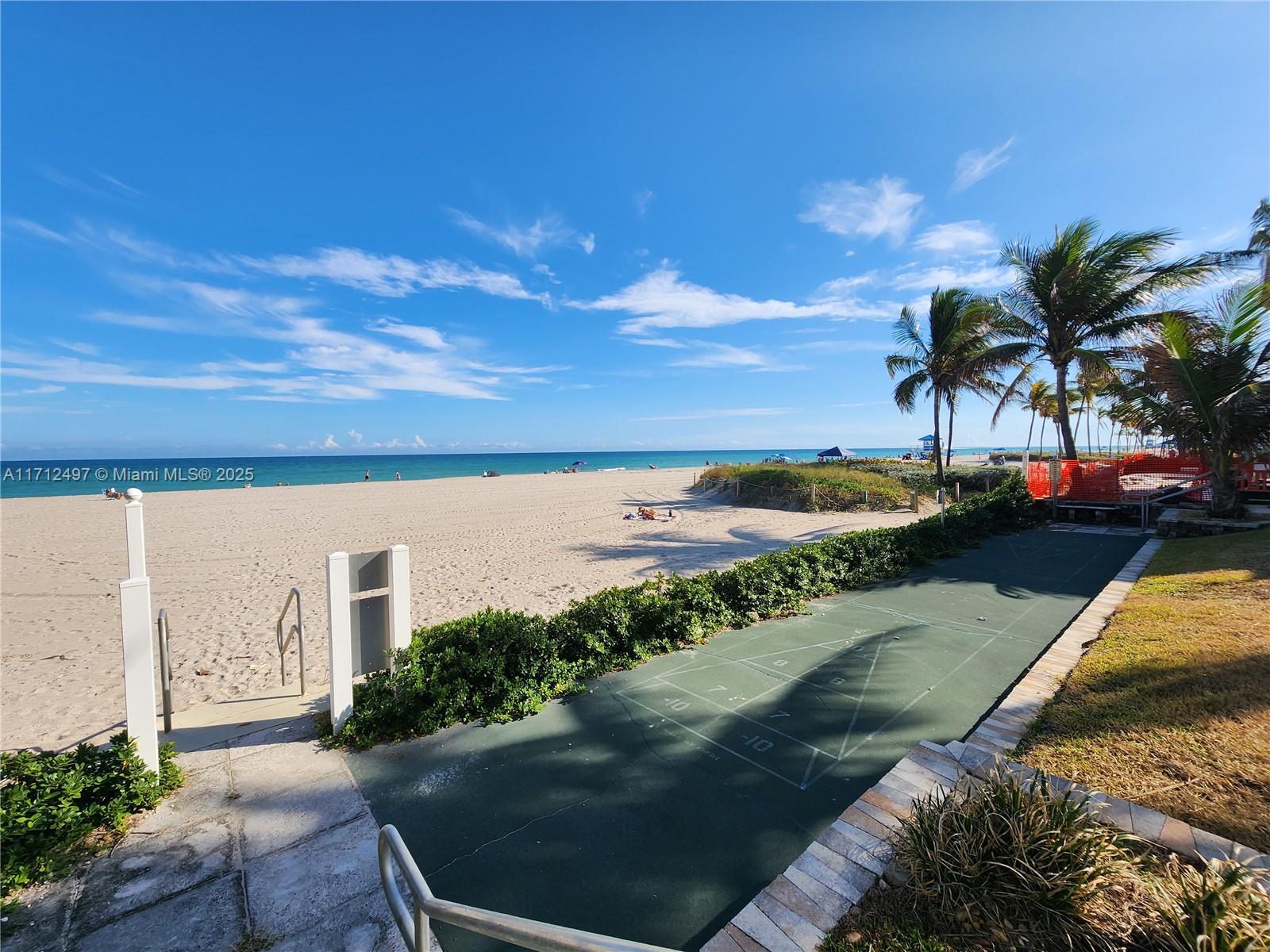 1504 South Surf Road, Unit 57 Hollywood, FL 33019 - Photo 25 of 27 a view of a ocean with a yard