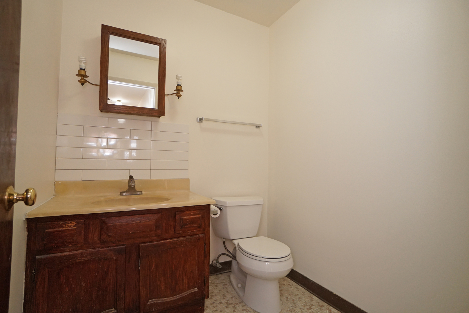 834 East Old Willow Road, Unit 209 Prospect Heights, IL 60070 - Photo 17 of 20 a bathroom with a granite countertop toilet sink and mirror