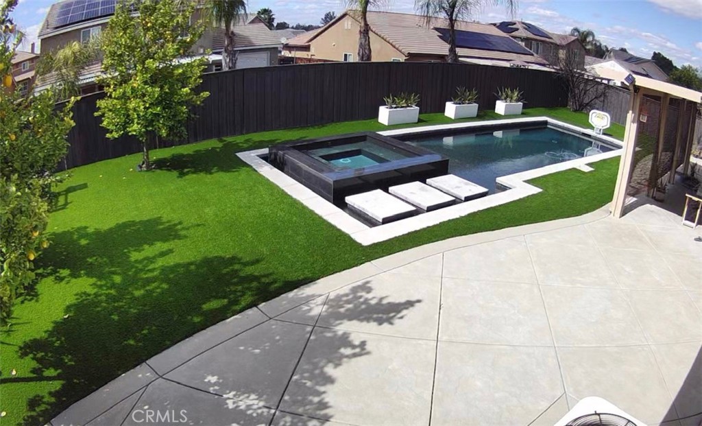 a view of a pool with a yard