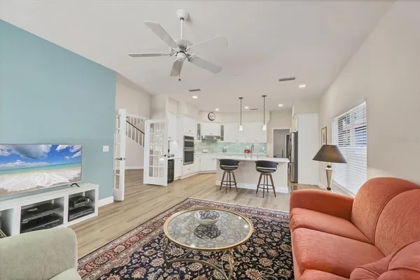 a room with a table chair and a potted plant