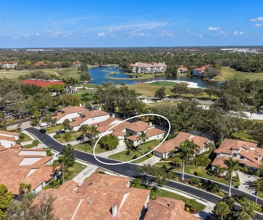 an aerial view of a residential houses with outdoor space