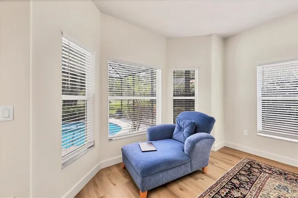 a spacious bedroom with a bed and a window