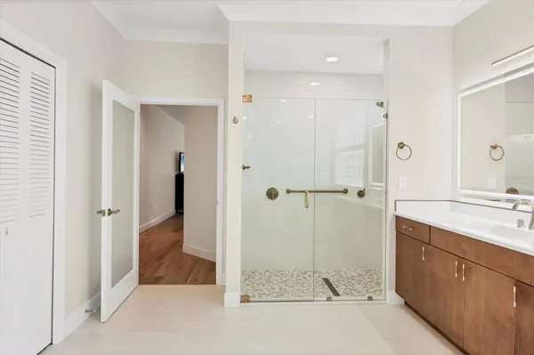 a bathroom with a double vanity sink a and a mirror
