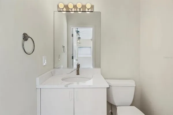 an aerial view of a house with a yard and balcony