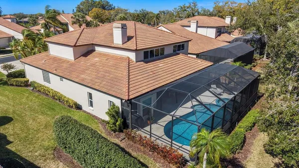 an aerial view of a house with a lake view