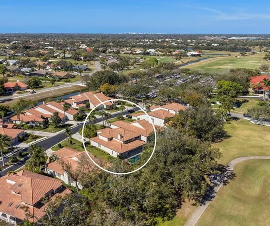 an aerial view of a house with a lake view