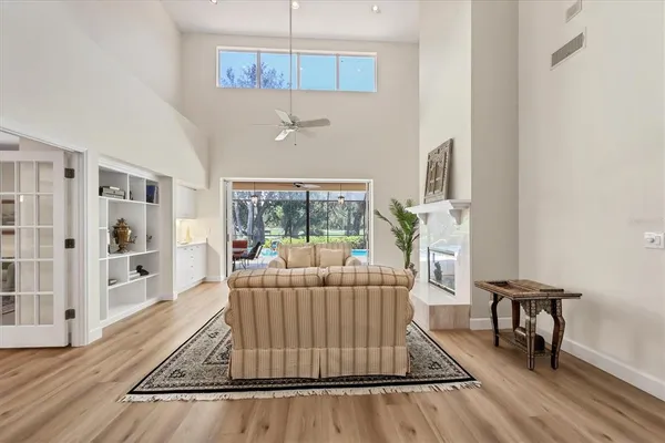 a living room with furniture and a large window
