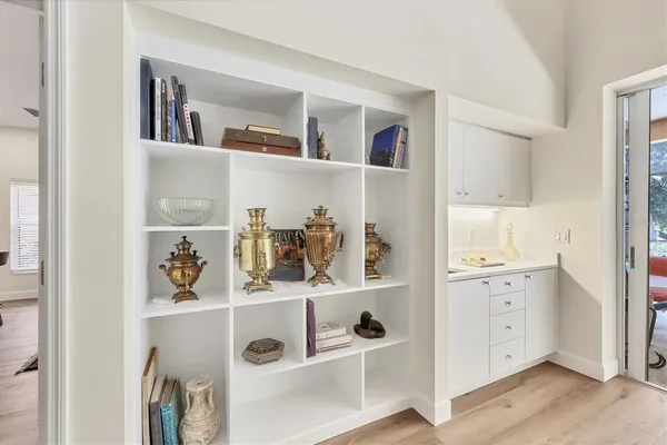 a kitchen with stainless steel appliances kitchen island granite countertop a stove a sink and a refrigerator