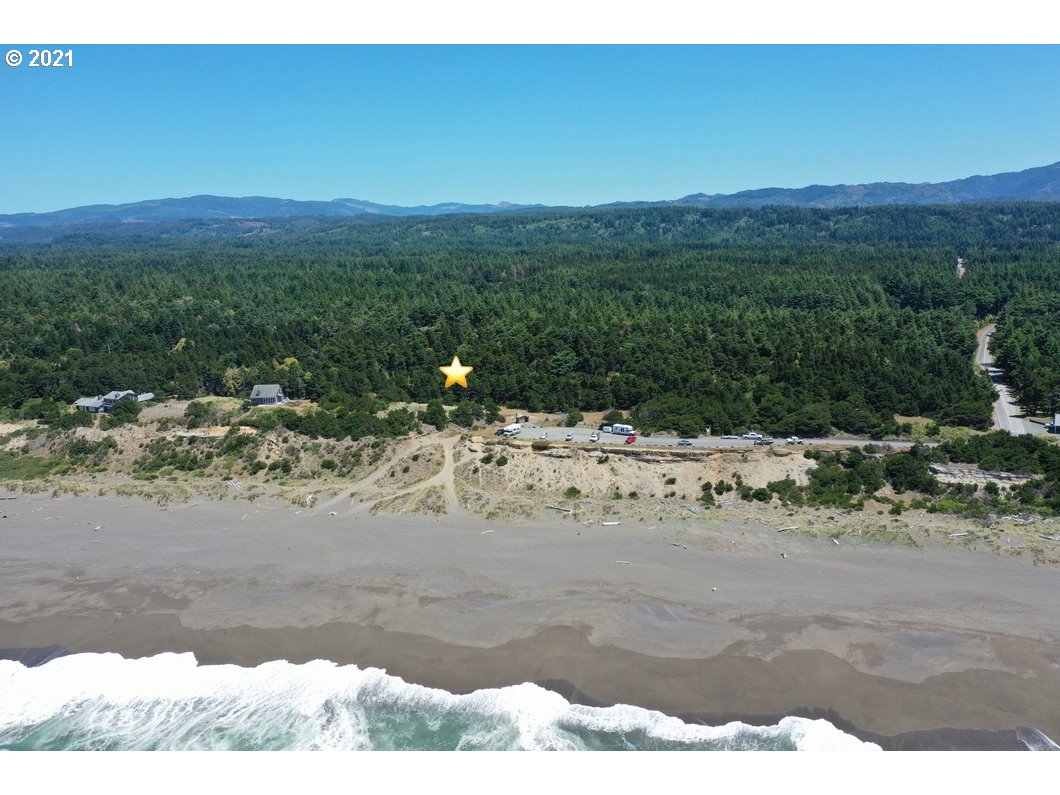 0 Gull Rd Port, Unit 1900 Port Orford, OR 97465 - Photo 1 of 18 a view of a yard with a mountain