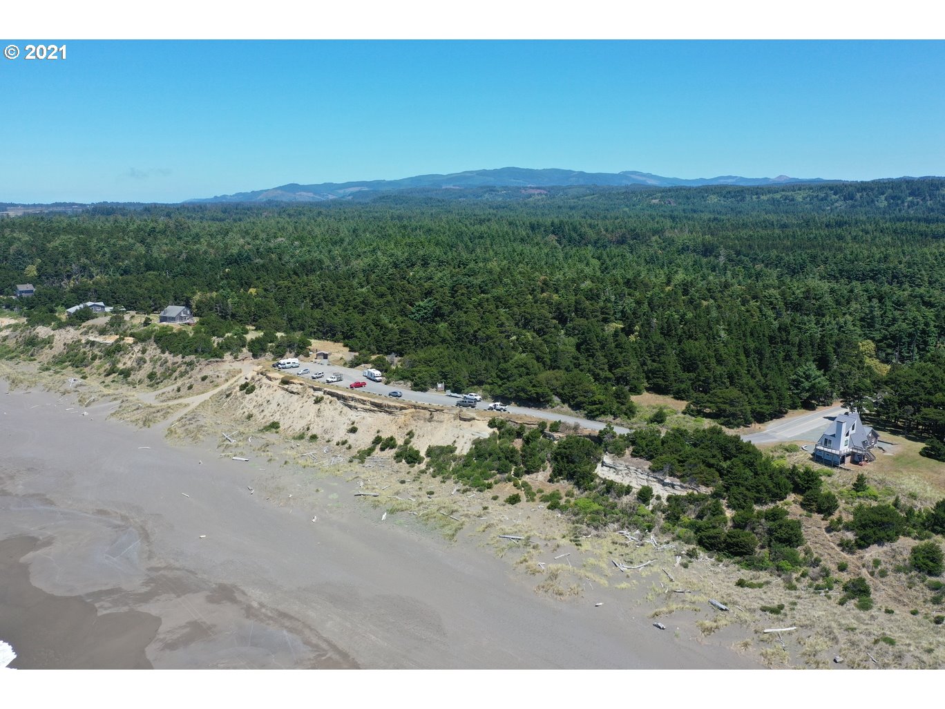0 Gull Rd Port, Unit 1900 Port Orford, OR 97465 - Photo 3 of 18 a view of a beach with a mountain