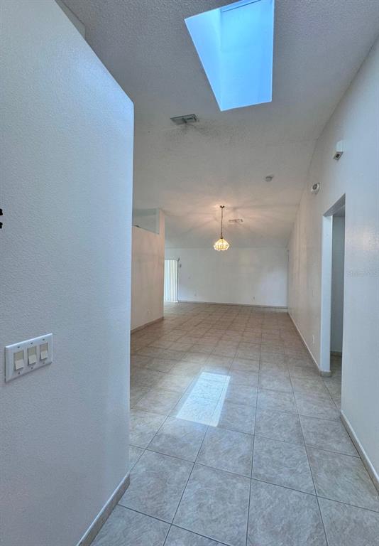 147 South Roma Way Kissimmee, FL 34746 - Photo 4 of 11 a view of a room with an empty space and a window