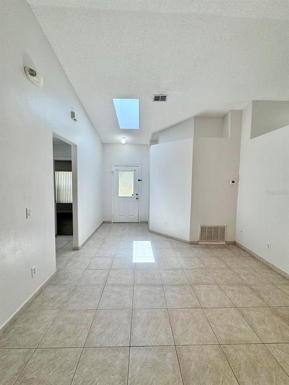 147 South Roma Way Kissimmee, FL 34746 - Photo 7 of 11 a view of an empty room with a window