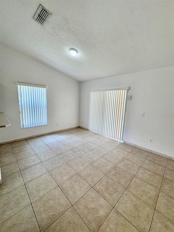 147 South Roma Way Kissimmee, FL 34746 - Photo 8 of 11 a view of an empty room and a window