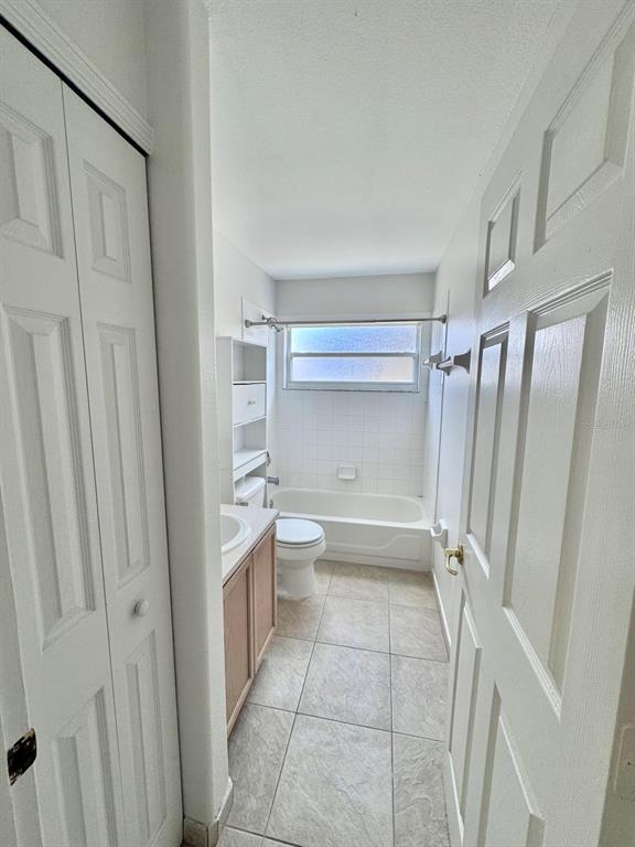 147 South Roma Way Kissimmee, FL 34746 - Photo 10 of 11 a bathroom with a double vanity sink toilet and shower