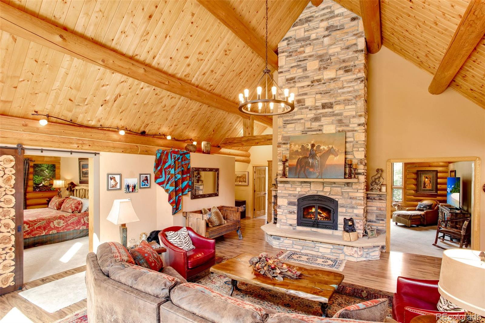 427 Wilderness Ridge Way Bellvue, CO 80512 - Photo 16 of 50 a living room with furniture and a fireplace