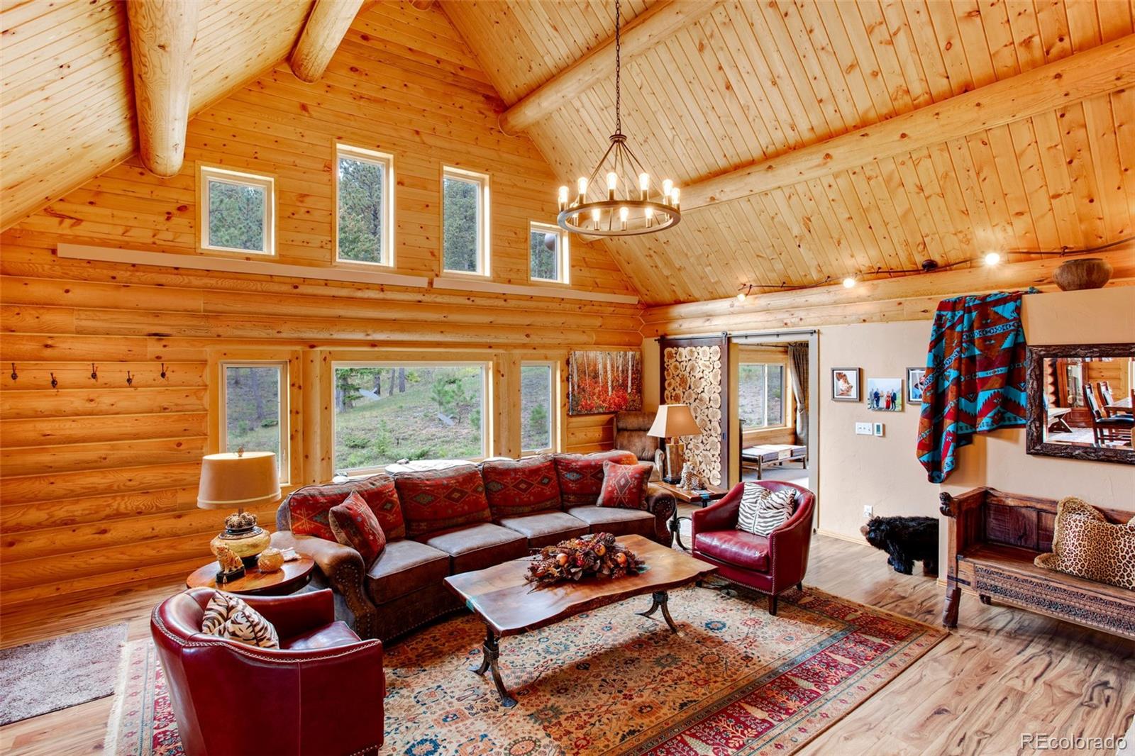 427 Wilderness Ridge Way Bellvue, CO 80512 - Photo 17 of 50 a living room with furniture and a window