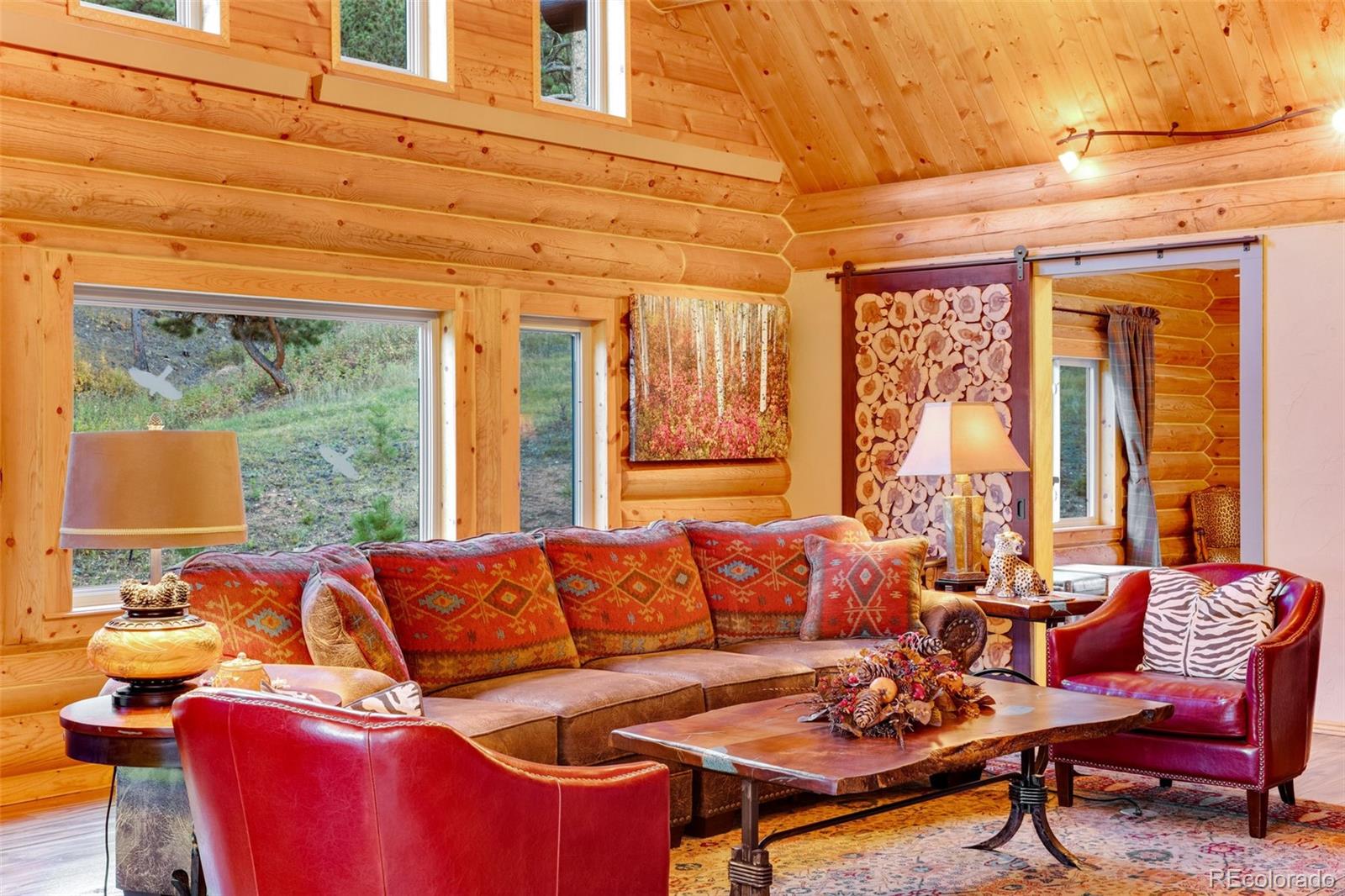 427 Wilderness Ridge Way Bellvue, CO 80512 - Photo 18 of 50 a living room with furniture and a large window