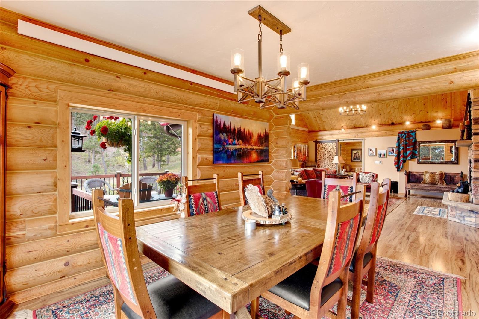 427 Wilderness Ridge Way Bellvue, CO 80512 - Photo 21 of 50 a view of a dining room and hall with furniture
