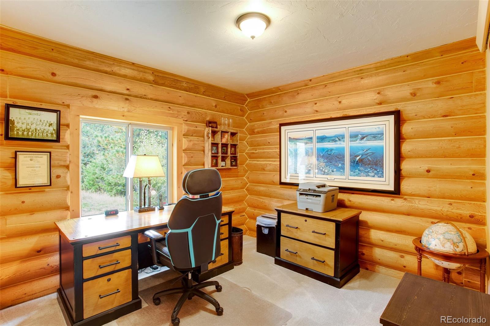 427 Wilderness Ridge Way Bellvue, CO 80512 - Photo 27 of 50 a work room with furniture and windows