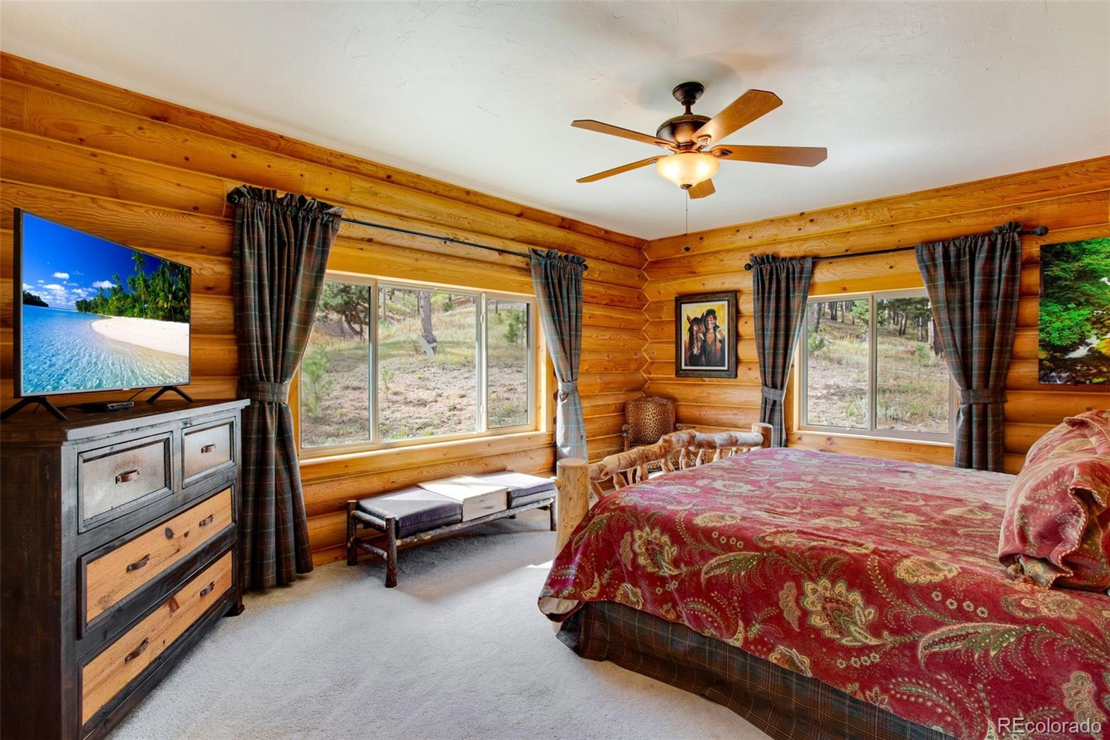 427 Wilderness Ridge Way Bellvue, CO 80512 - Photo 29 of 50 a bed room with a bed and a window