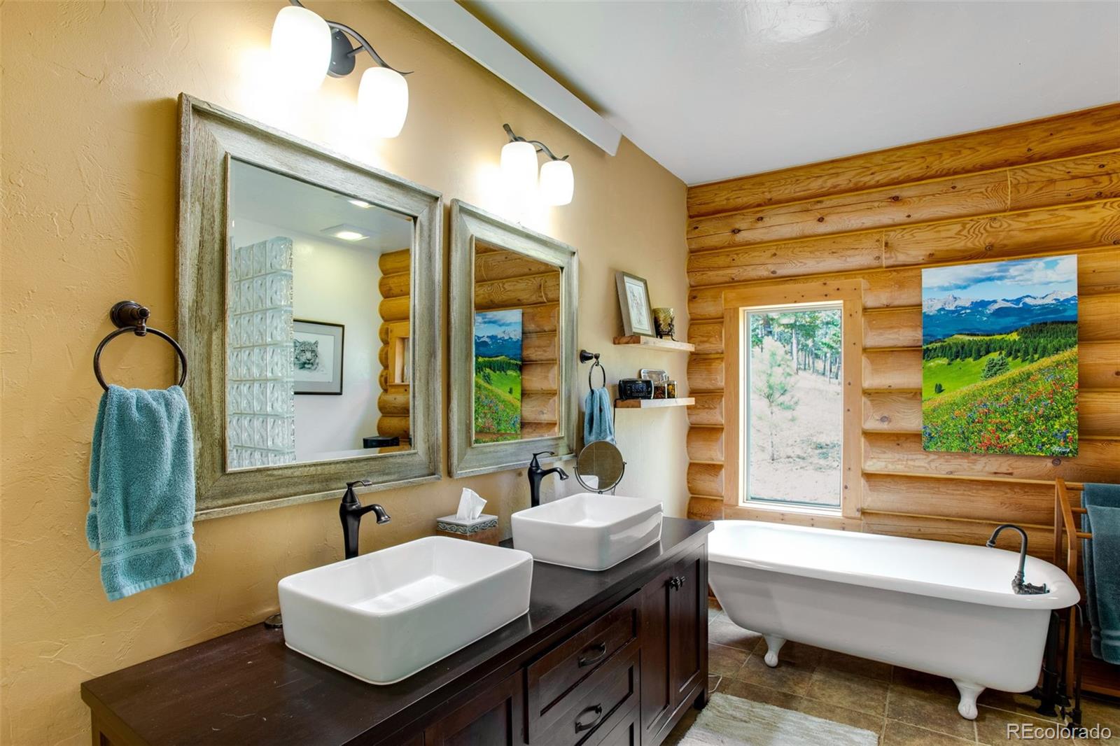 427 Wilderness Ridge Way Bellvue, CO 80512 - Photo 33 of 50 a bathroom with a granite countertop sink and a mirror