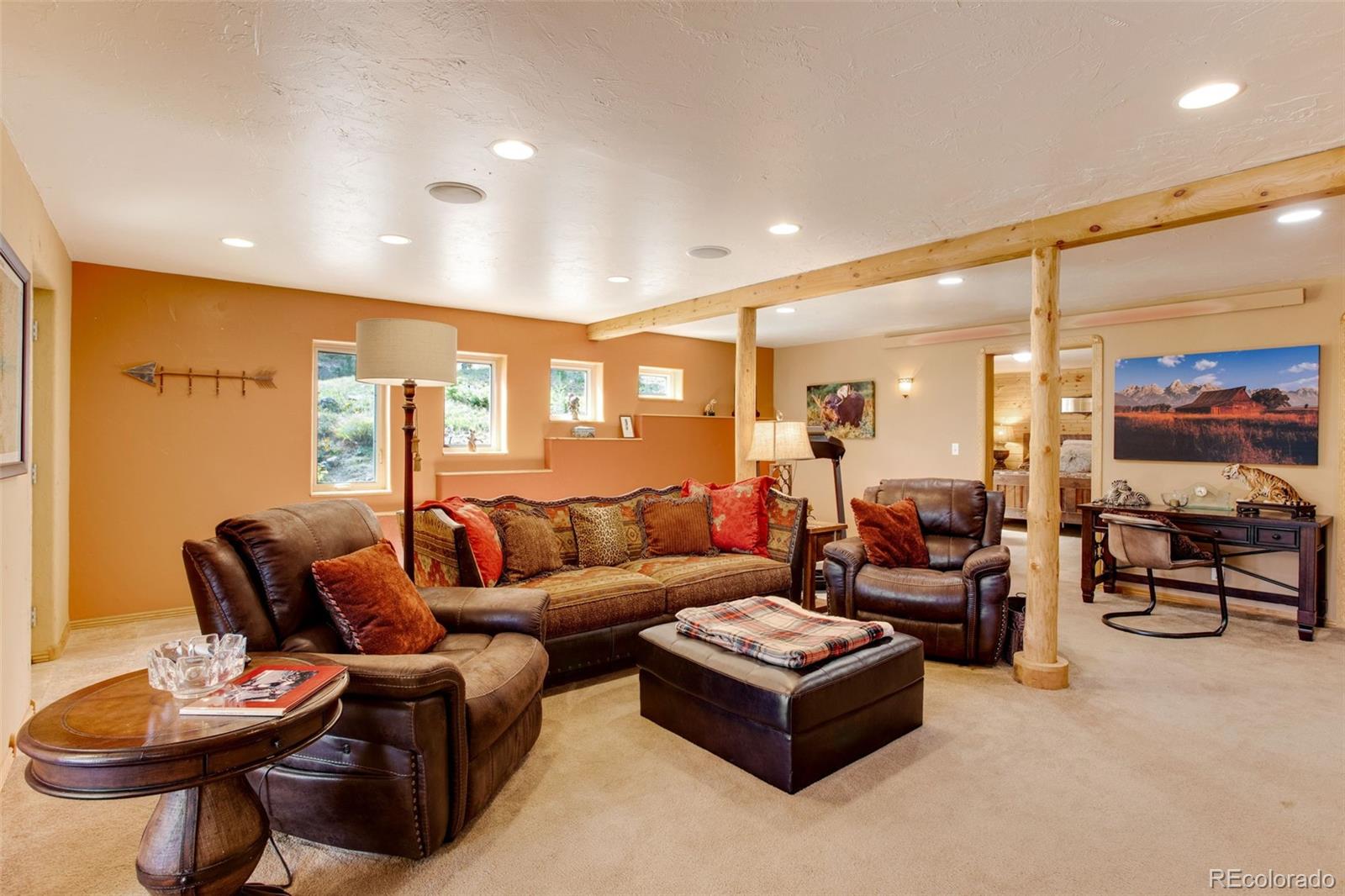 427 Wilderness Ridge Way Bellvue, CO 80512 - Photo 36 of 50 a living room with furniture kitchen view and a large window