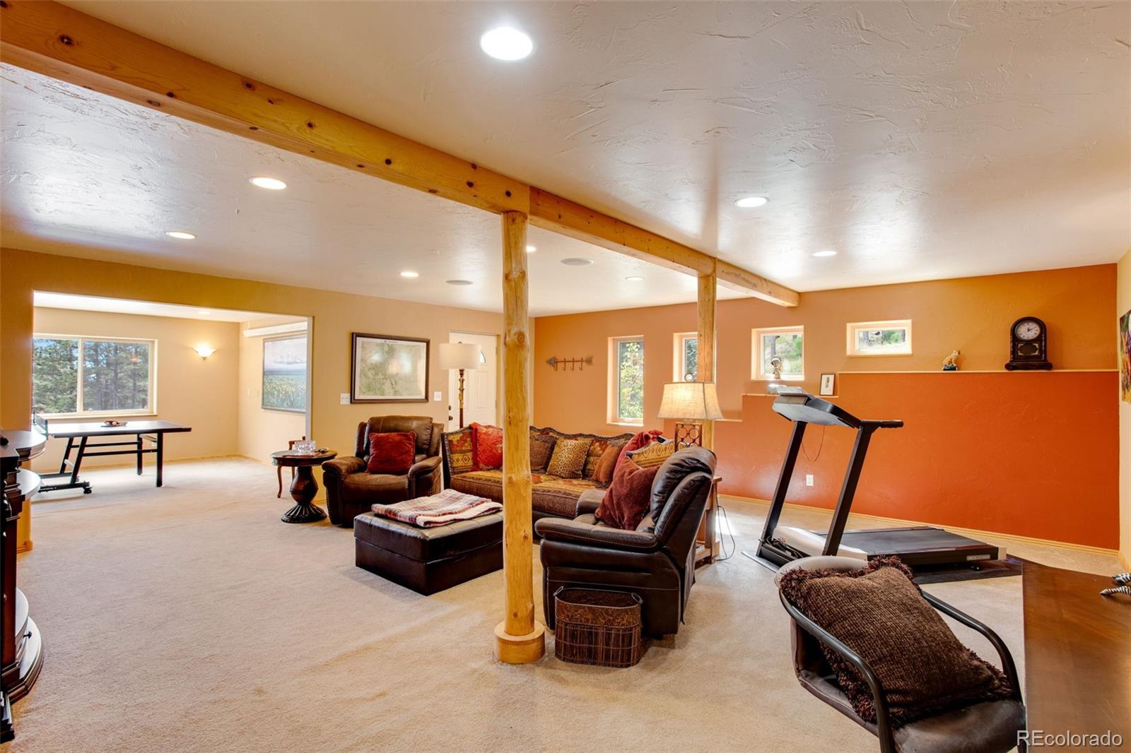 427 Wilderness Ridge Way Bellvue, CO 80512 - Photo 37 of 50 a living room with furniture a couch and large window