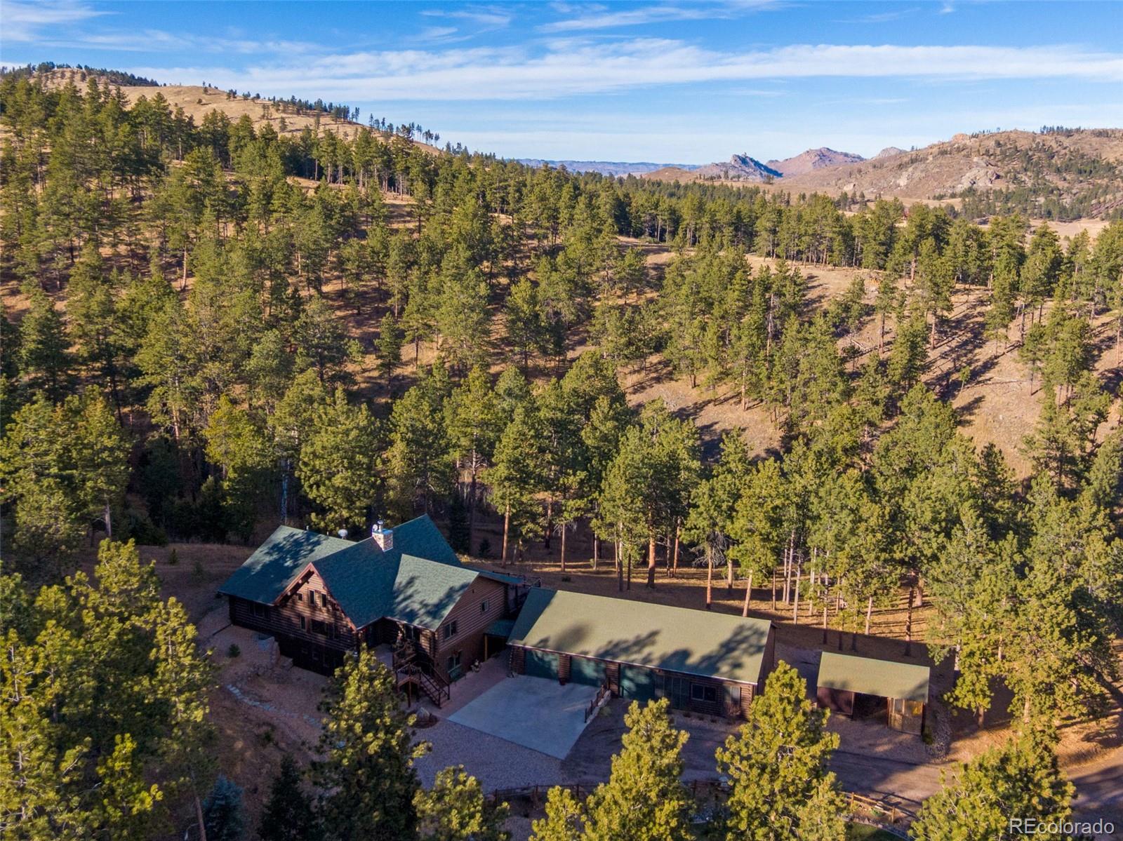 427 Wilderness Ridge Way Bellvue, CO 80512 - Photo 4 of 50 an aerial view of a house with a yard