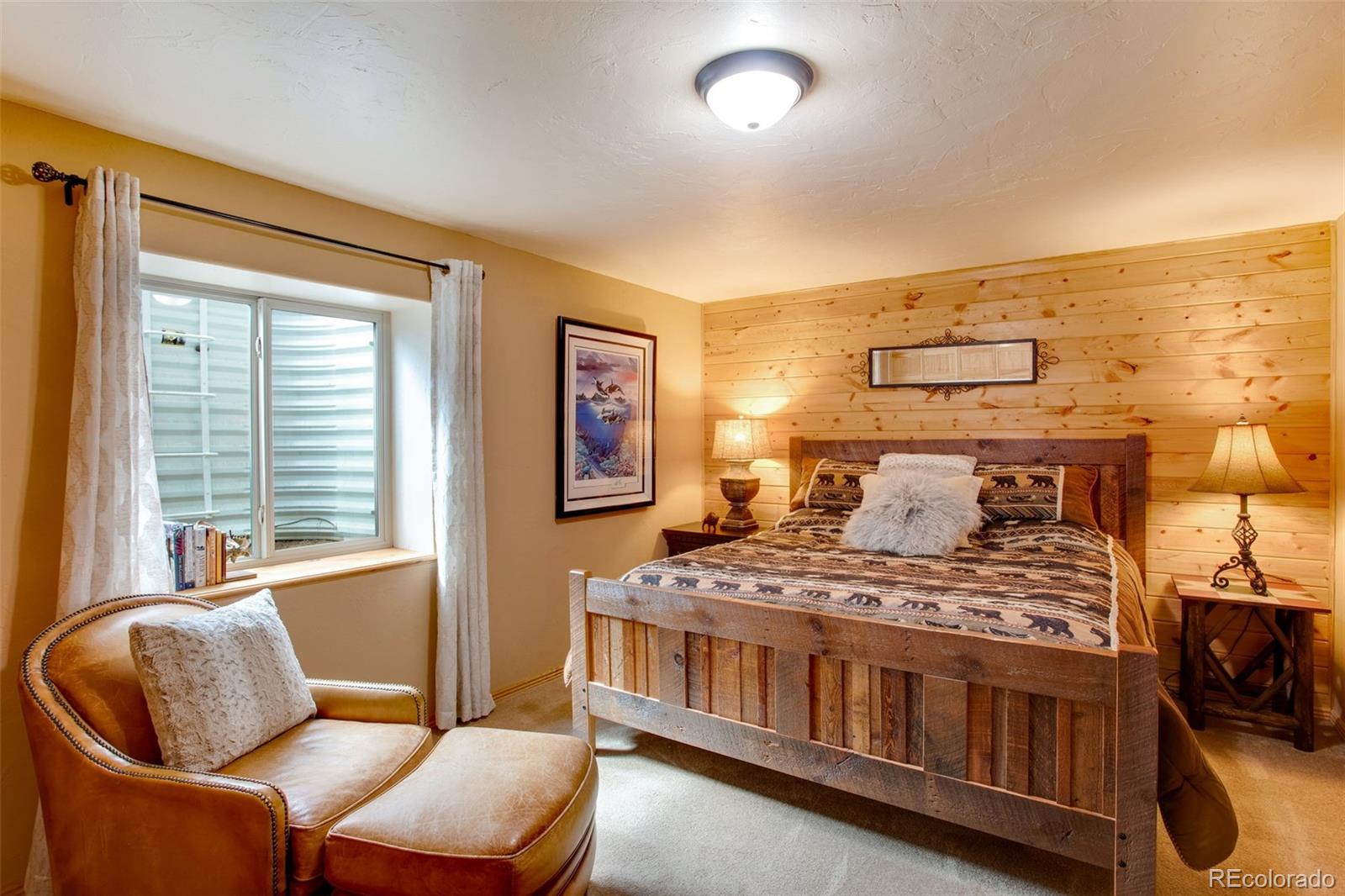 427 Wilderness Ridge Way Bellvue, CO 80512 - Photo 41 of 50 a bedroom with furniture and windows