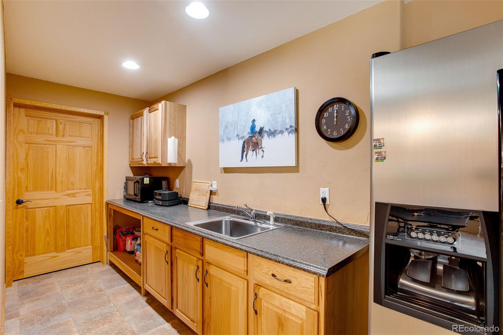 427 Wilderness Ridge Way Bellvue, CO 80512 - Photo 43 of 50 a kitchen with a sink and a stove top oven