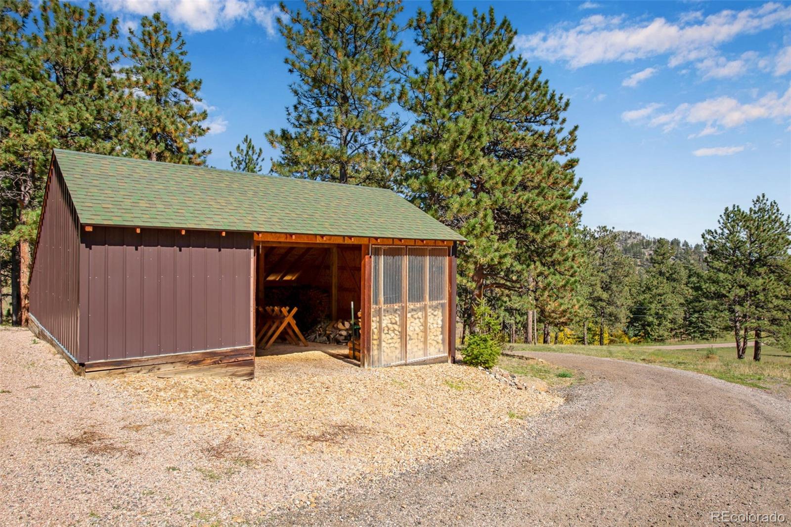 427 Wilderness Ridge Way Bellvue, CO 80512 - Photo 46 of 50 a view of a backyard