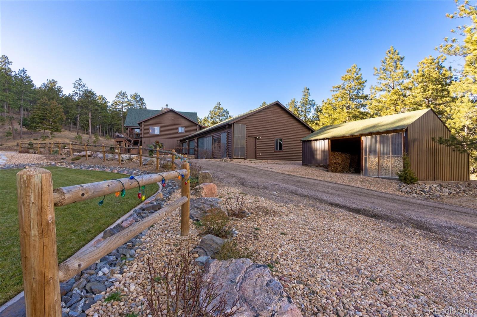 427 Wilderness Ridge Way Bellvue, CO 80512 - Photo 47 of 50 a view of a house with a yard