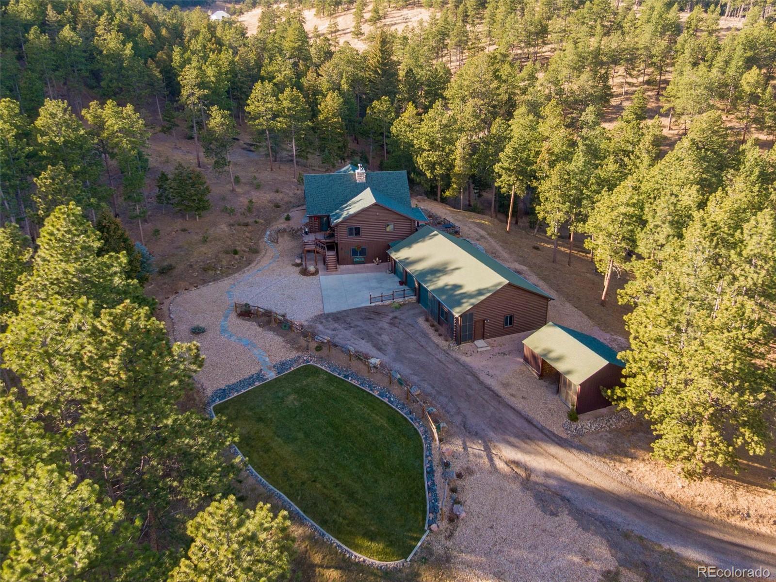 427 Wilderness Ridge Way Bellvue, CO 80512 - Photo 48 of 50 an aerial view of a house with a yard