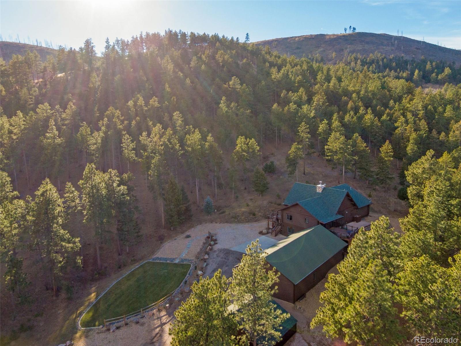 427 Wilderness Ridge Way Bellvue, CO 80512 - Photo 5 of 50 an aerial view of a house with mountain view