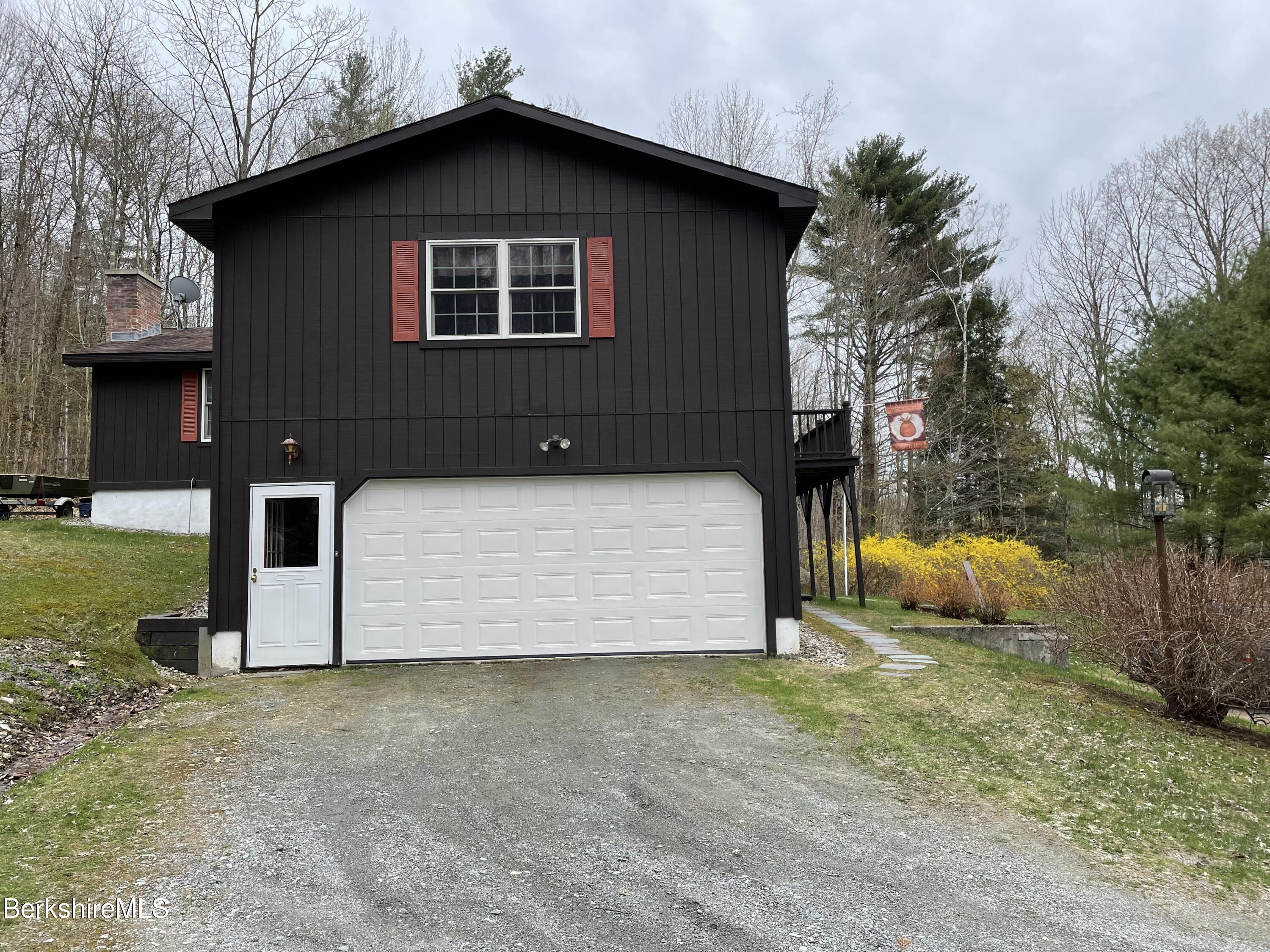 848 E Road Stamford, VT 05352 - Photo 23 of 26 a front view of a house with yard garage and sitting area