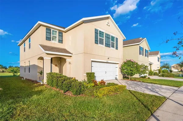 a front view of a house with a yard