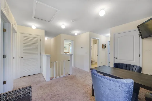 a bedroom with a bed and a large mirror