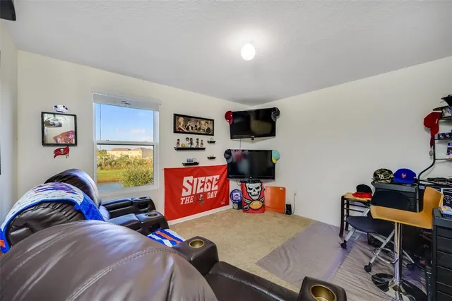 a bedroom with a bed and a couch