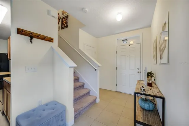 a living room with furniture a clock and a window