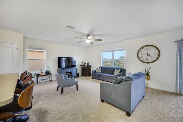 a living room with furniture and a window