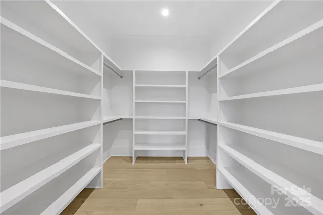 a kitchen with white cabinets