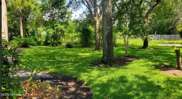 a view of backyard with green space