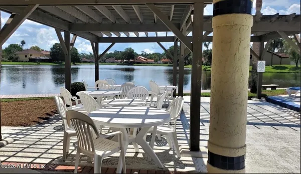 a view of balcony and dining room with furniture